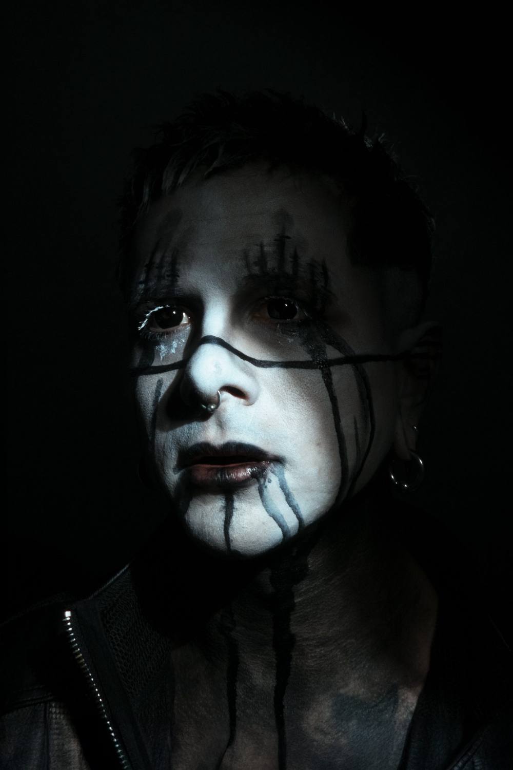 Dark Hour techno DJ portrait in black-and-white face paint